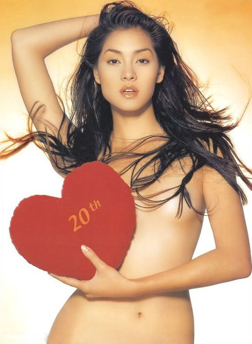Thai supermodel Methinee wearing only a heart shaped chocolate box