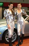 Car show girls in silver space suits