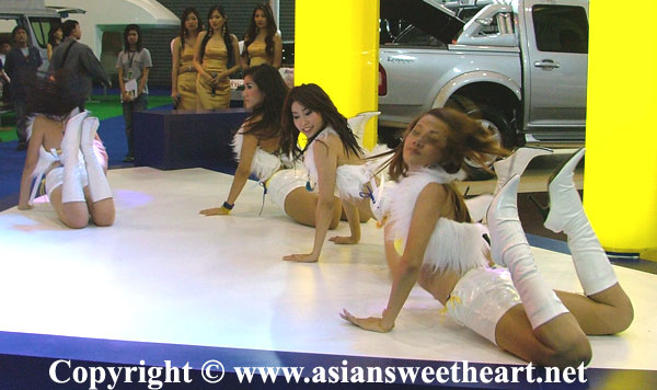 Auto show dancers get down and dirty in their routine