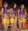 Tiger motorcycle girls in gold hot pants and purple tops