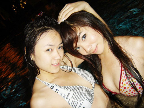 Nong Sweet and her girlfriend in the pool a little hug