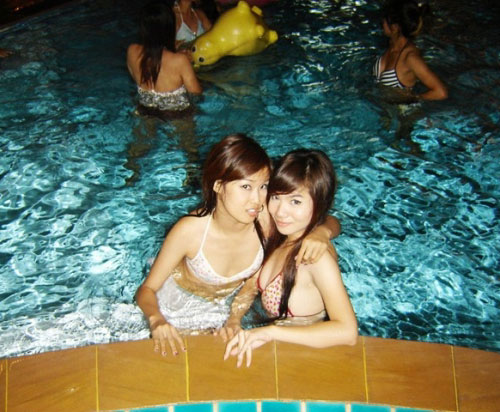 Another girl hugging Nong Sweet in the pool